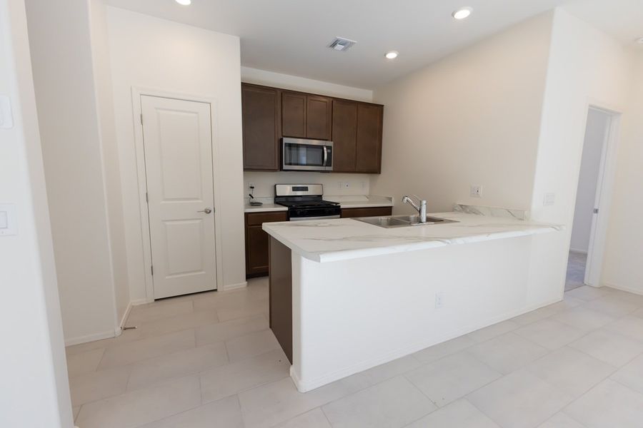 Furnished interior view inside a new home in Bella Tierra, Tucson (Image 3).