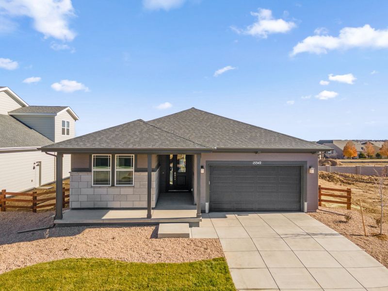 Front exterior of a new home in Talon Pointe, Thornton, CO, highlighting curb appeal (Image 1). Front exterior of a new home in Talon Pointe, Thornton, CO, highlighting curb appeal (Image 1).