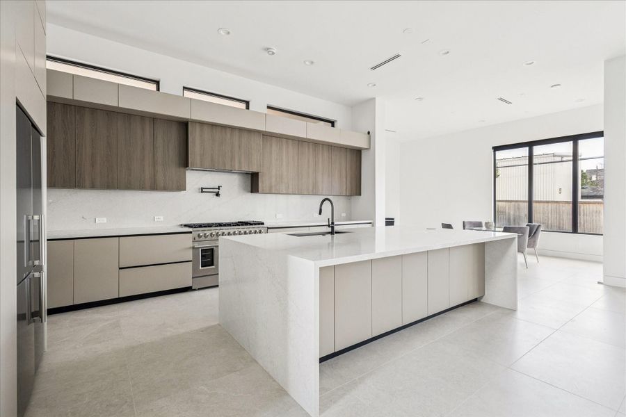 The sleek kitchen cabinetry is imported from Italy.