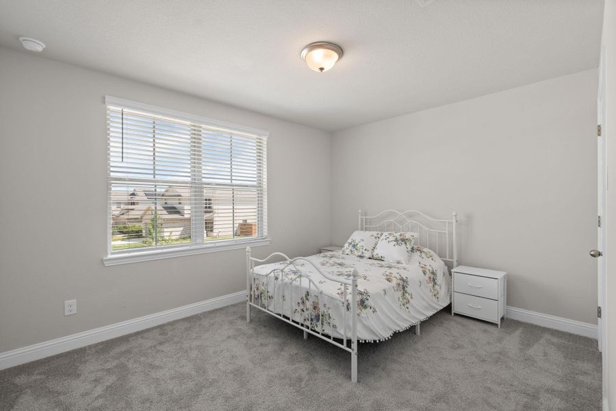 Furnished interior view inside a new home in Sunterra, Katy (Image 27).