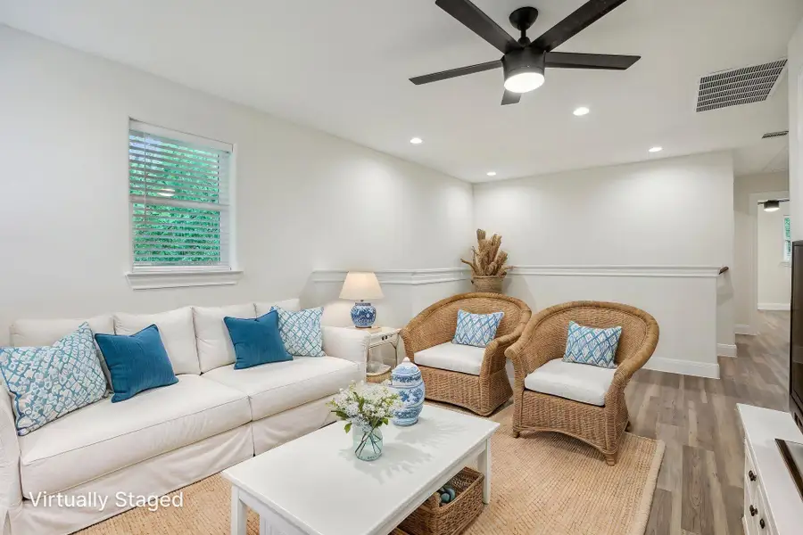 Virtually Staged Upstairs Family room featuring recessed lighting, visible vents, a healthy amount of sunlight, light wood-style floors, and ceiling fan
