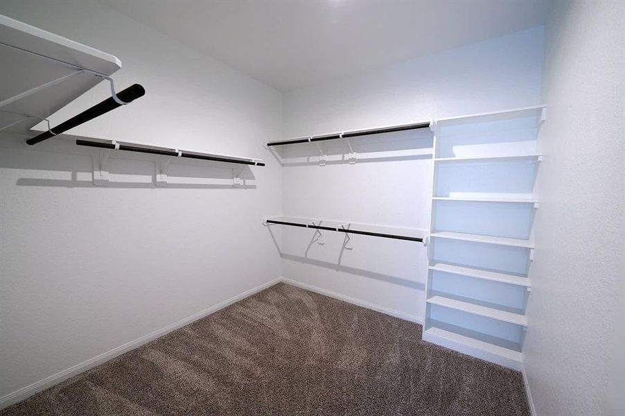 Primary walk-in closet.