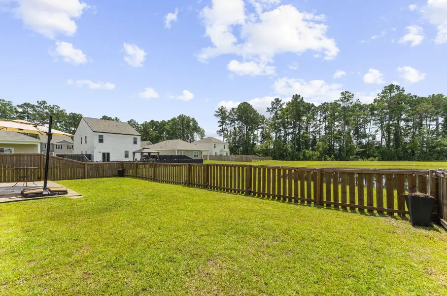 Exterior details and patio area of a home in Pine Hills at Cane Bay, Summerville (Image 27).