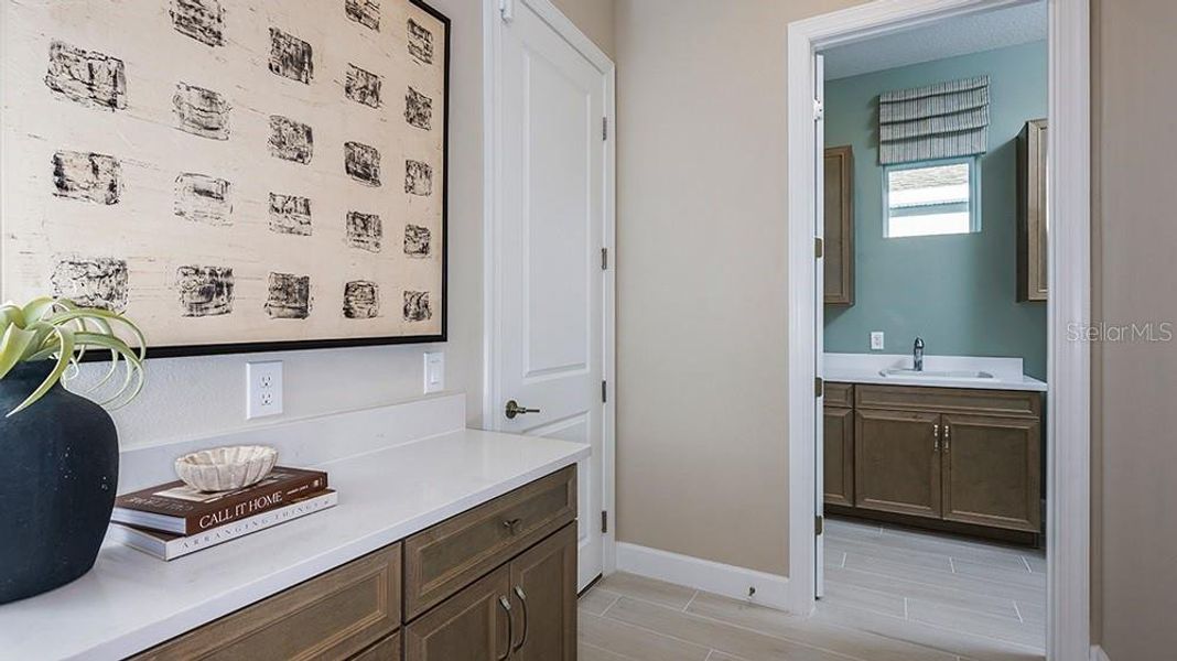 Furnished interior view inside a new home in Esplanade at McKinnon Groves, Winter Garden (Image 9).