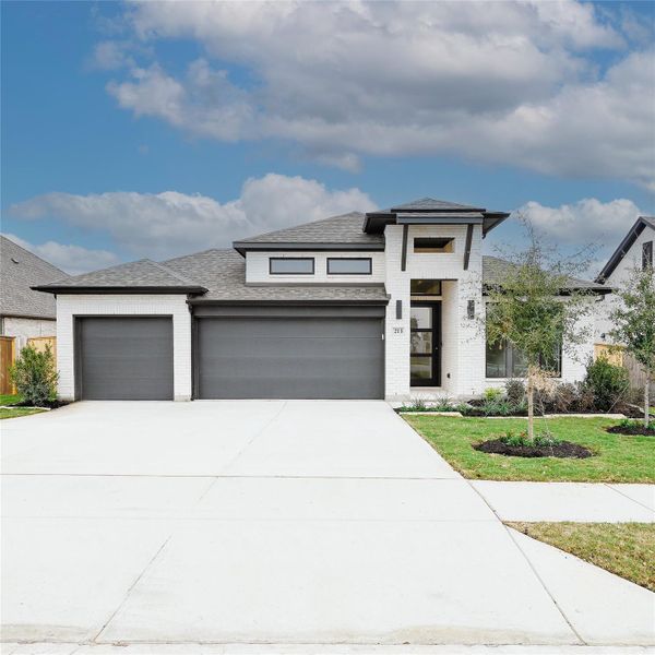 Front exterior of a new home in La Cima 60', San Marcos, TX, highlighting curb appeal (Image 18). Front exterior of a new home in La Cima 60', San Marcos, TX, highlighting curb appeal (Image 18).