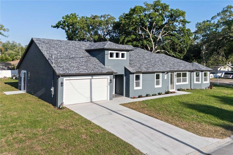 Front exterior of a new home in , Tampa, FL, highlighting curb appeal (Image 25).