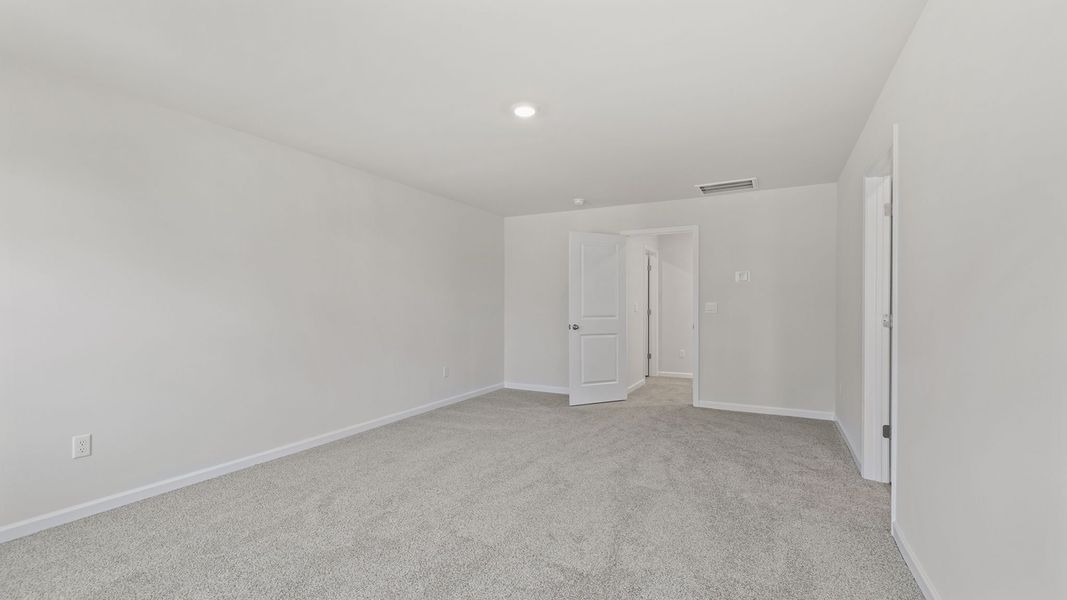 Spacious, unfurnished interior of a new home in Bentley Park, Greenwood (Image 28).