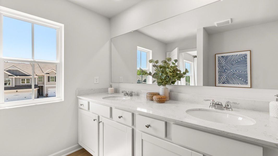 Representative furnished interior of a home built from the ADDINGTON by D.R. Horton in Waypoint, Flowery Branch (Image 27).