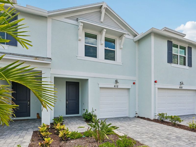 Front exterior of a new home in Tidewater, Fort Pierce, FL, highlighting curb appeal (Image 17).