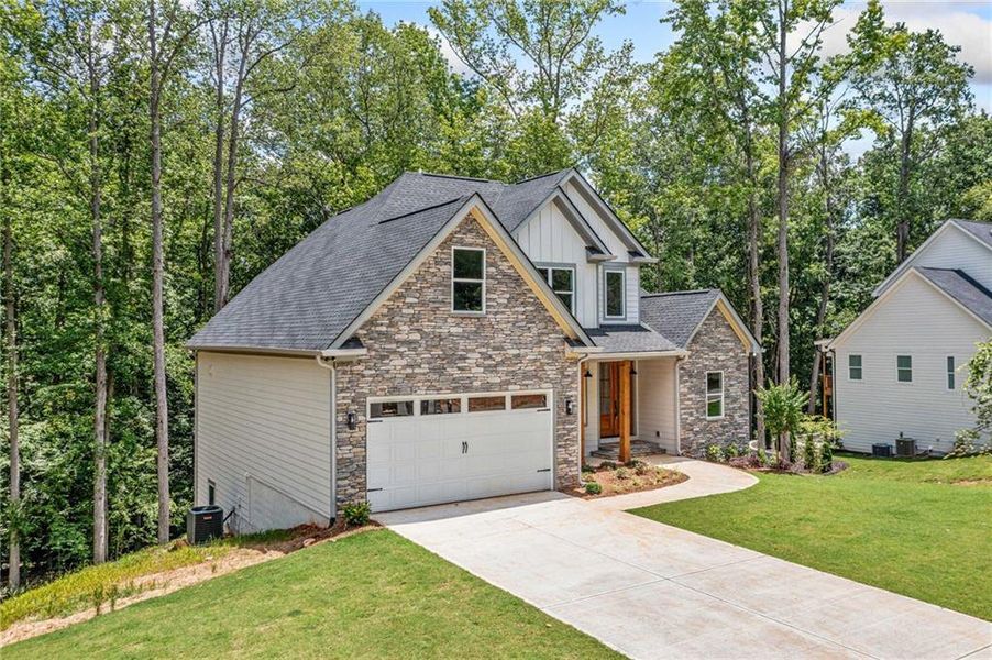 Front exterior of a new home in , Canton, GA, highlighting curb appeal (Image 2).