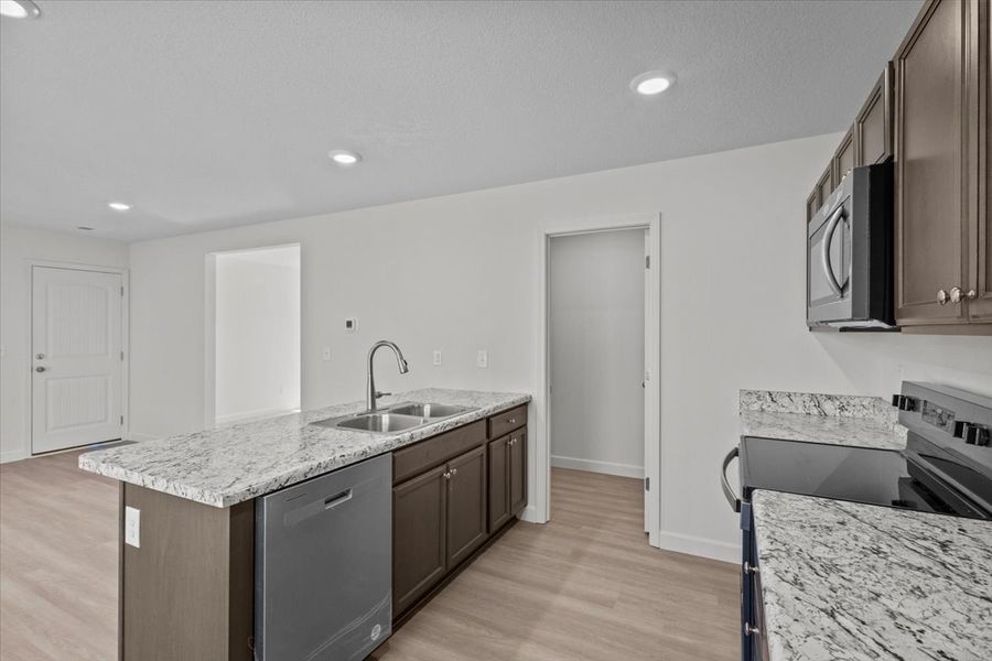 Representative furnished interior of a home built from the Roebuck by Enchanted Homes in Las Palomas Country Club Estates, La Vernia (Image 8).