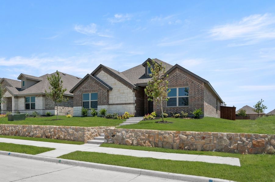 Front exterior of a new home in Redden Farms, Midlothian, TX, highlighting curb appeal (Image 2). Front exterior of a new home in Redden Farms, Midlothian, TX, highlighting curb appeal (Image 2).