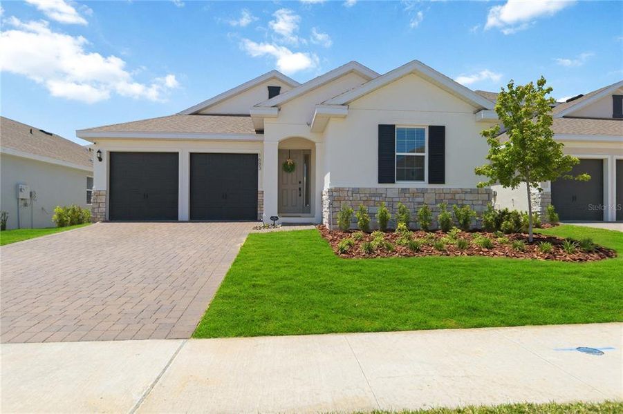 Front exterior of a new home in , Clermont, FL, highlighting curb appeal (Image 21).