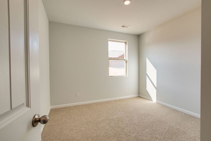 Representative unfurnished interior of a home built from the HAYDEN by D.R. Horton in The Parks, White House (Image 15).