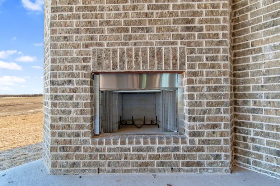 Optional Patio Fireplace | Concept 2915 at The Meadows in Gunter, TX by Landsea Homes