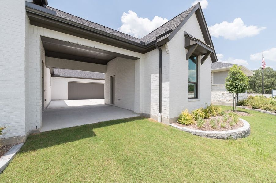 Exterior details and patio area of a home in Dunham Pointe 80′, Cypress (Image 3). Exterior details and patio area of a home in Dunham Pointe 80′, Cypress (Image 3).