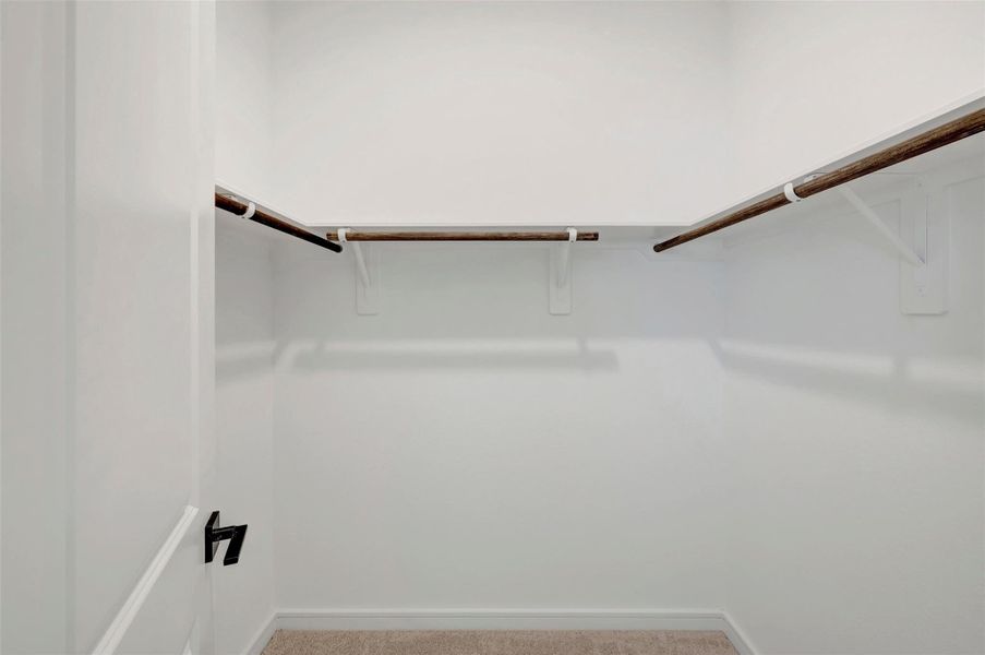 Primary walk-in closet Primary walk-in closet