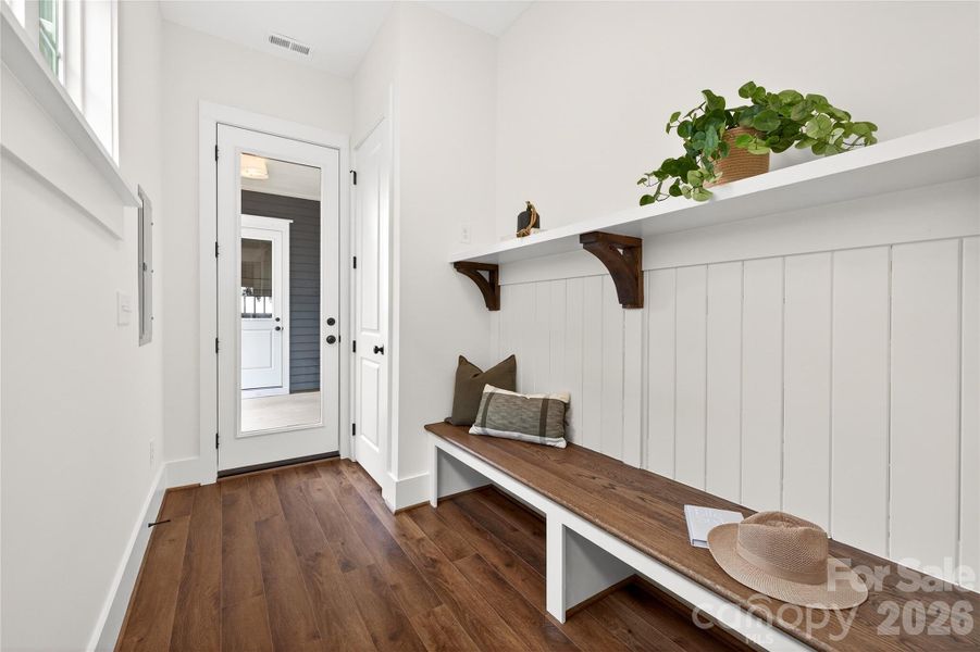 Convenient drop zone and closet space located at the rear entry provides the perfect spot for coats and daily storage.