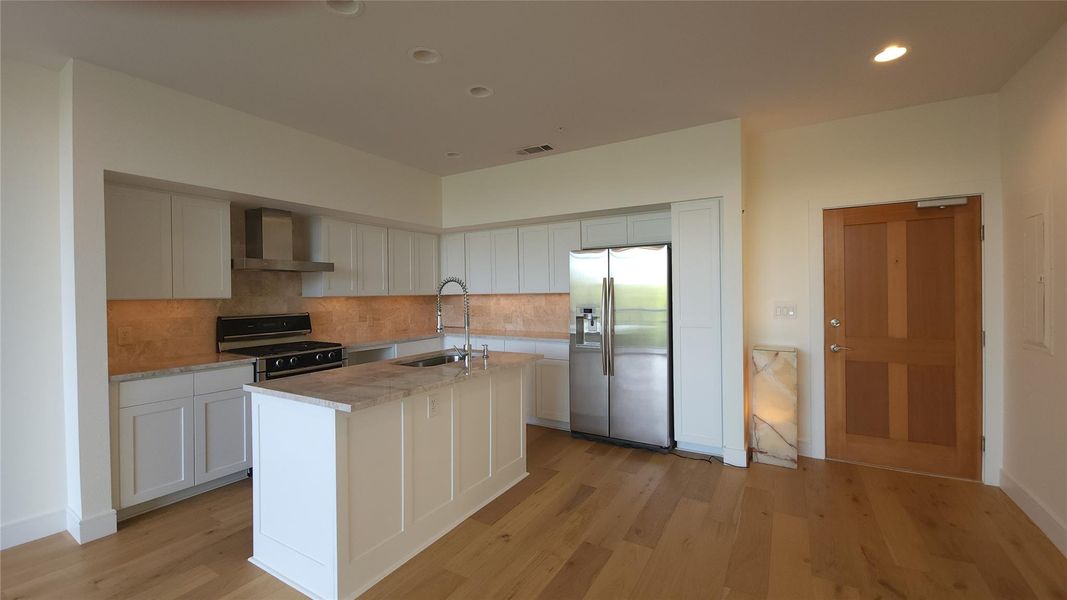 Extra wall of custom cabinets & space for add'l dining table. $1,000 allowance for cabinet pulls (didn't add hardware in order to preserve Cabinet finish & allow owner to choose their preferred 'jewelry').