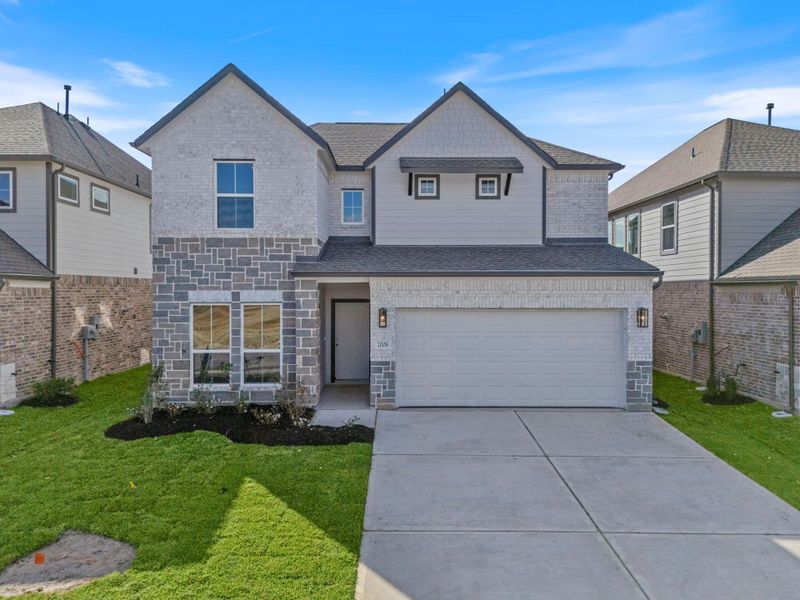 Front exterior of a new home in Barton Creek Ranch, Conroe, TX, highlighting curb appeal (Image 17).