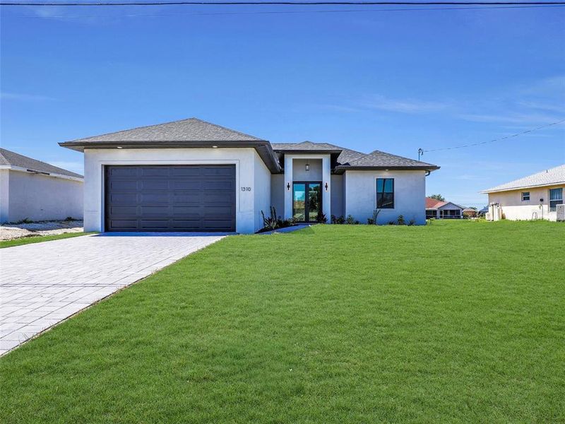 Front exterior of a new home in , Cape Coral, FL, highlighting curb appeal (Image 22).