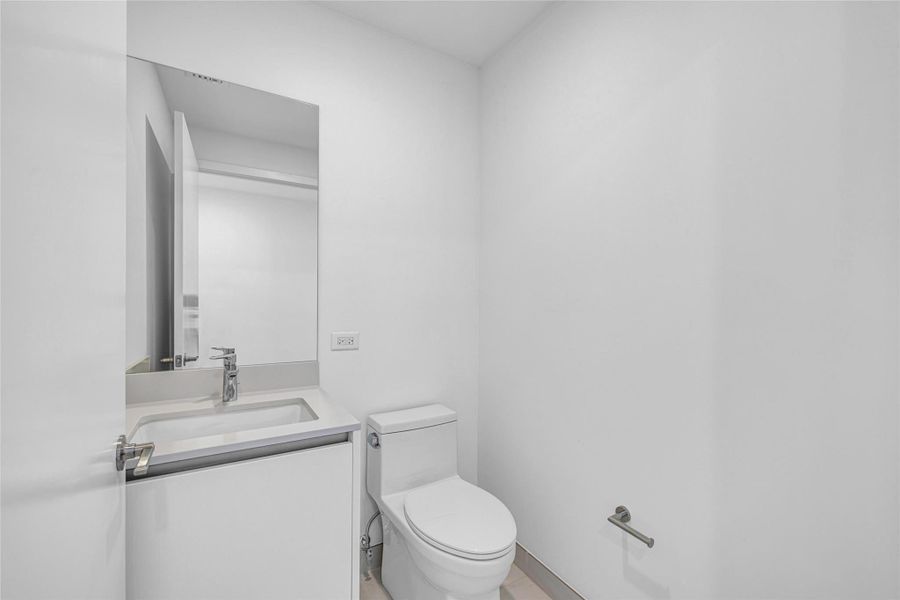 Powder Room located in the Foyer Entry