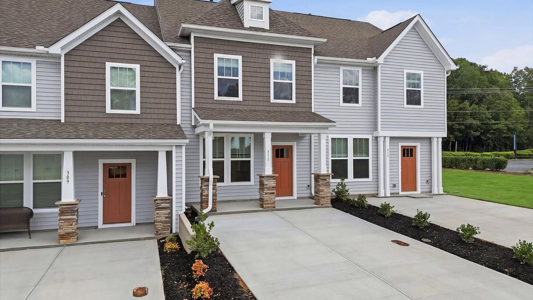 Front exterior of a new home in Clarke Townes, Anderson, SC, highlighting curb appeal (Image 1). Front exterior of a new home in Clarke Townes, Anderson, SC, highlighting curb appeal (Image 1).