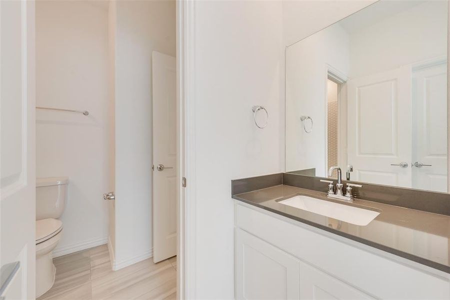 Bathroom with vanity and toilet