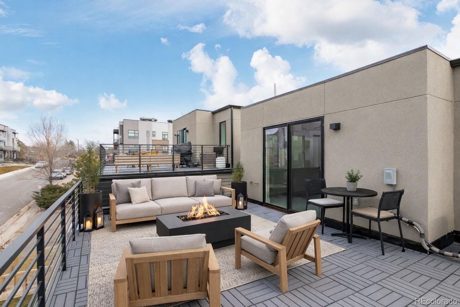 3rd floor walk-out deck with water and gas hookups (virtual staging)