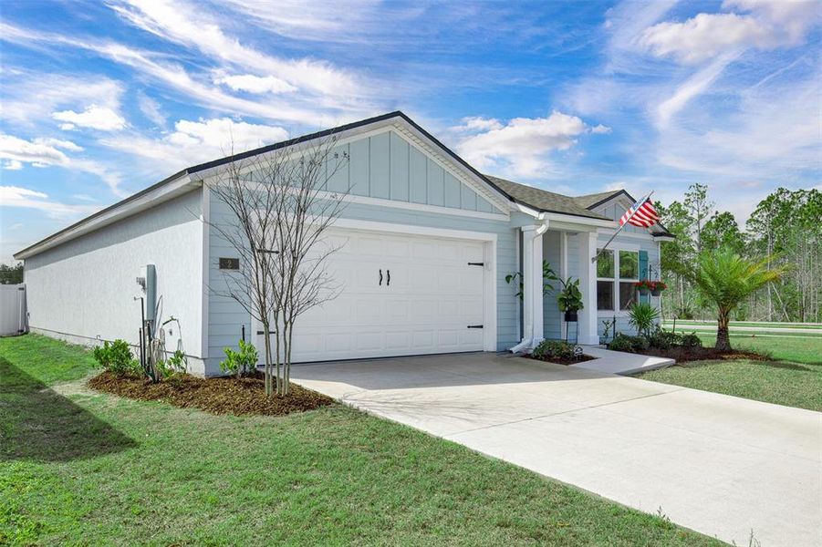 Front exterior of a new home in , Palm Coast, FL, highlighting curb appeal (Image 23).