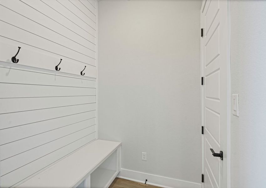 The mudroom has a bench and hooks. The mudroom has a bench and hooks.