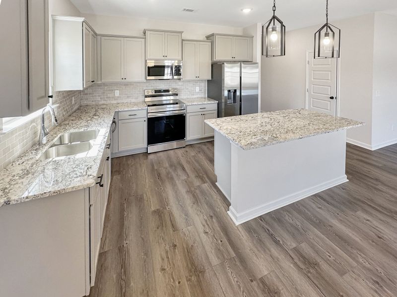 Furnished interior view inside a new home in Grand Reserve, Ludowici (Image 9).