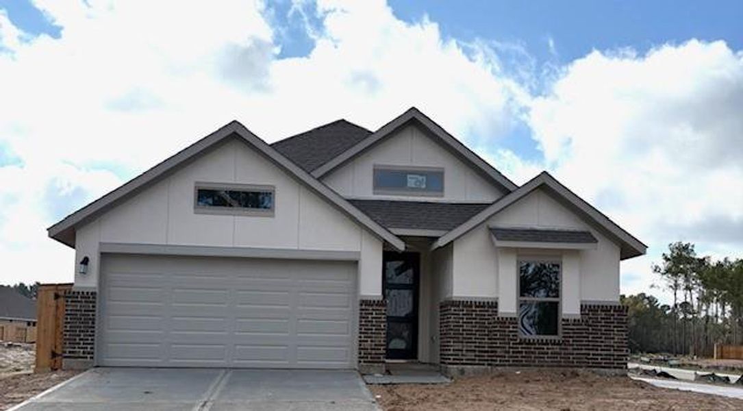 Front exterior of a new home in The Highlands 45', Porter, TX, highlighting curb appeal (Image 2). Front exterior of a new home in The Highlands 45', Porter, TX, highlighting curb appeal (Image 2).