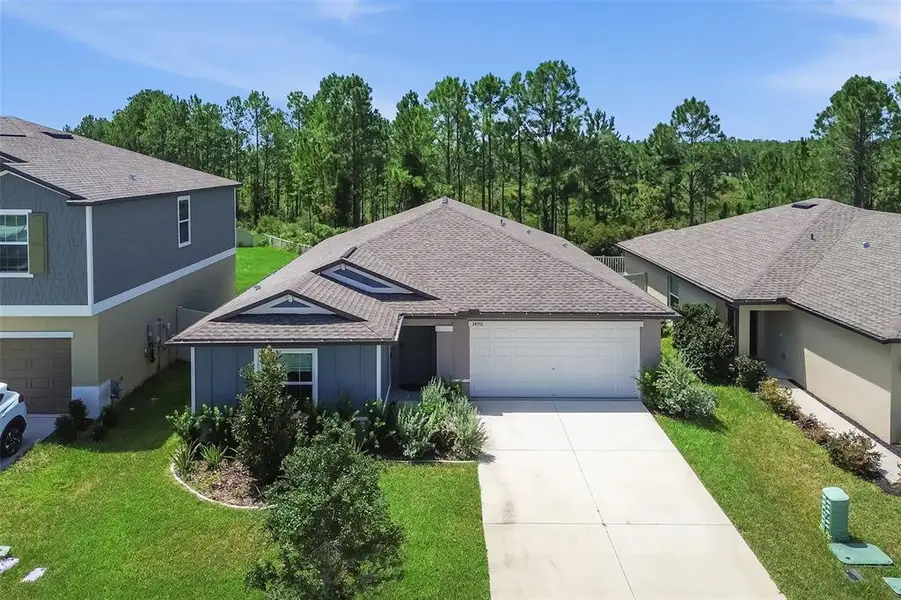 Front exterior of a new home in , Zephyrhills, FL, highlighting curb appeal (Image 1). Front exterior of a new home in , Zephyrhills, FL, highlighting curb appeal (Image 1).