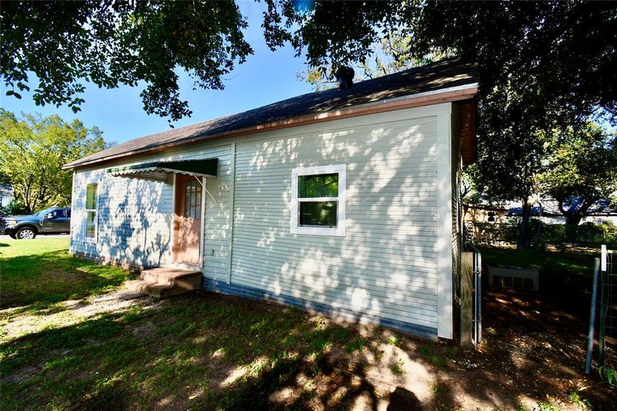 Side of house with door into dining area Side of house with door into dining area
