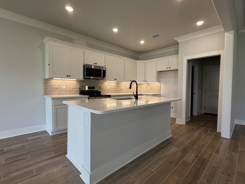 Furnished interior view inside a new home in Natureview, Freeport (Image 5).