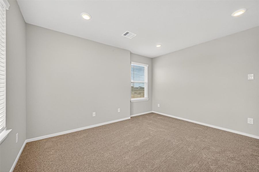 Spacious, unfurnished interior of a new home in Sunterra, Katy (Image 34).