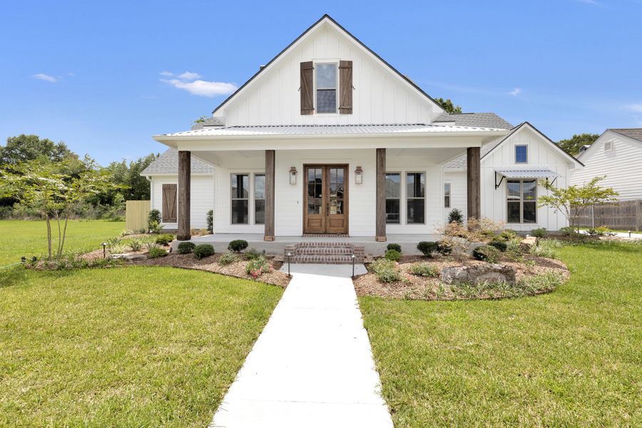 Representative exterior photo of a completed home built from the The Champagne by Manuel Builders in Chapel Bend, Montgomery, TX (Image 26). Representative exterior photo of a completed home built from the The Champagne by Manuel Builders in Chapel Bend, Montgomery, TX (Image 26).