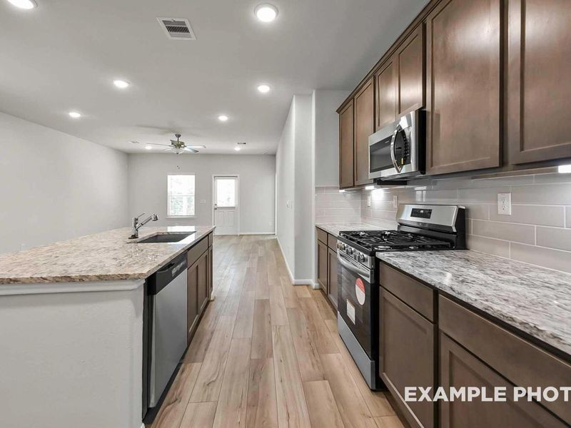 Furnished interior view inside a new home in Caney Creek Place, Conroe (Image 7).