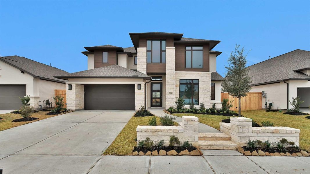Front exterior of a new home in Sienna, Missouri City, TX, highlighting curb appeal (Image 2). Front exterior of a new home in Sienna, Missouri City, TX, highlighting curb appeal (Image 2).