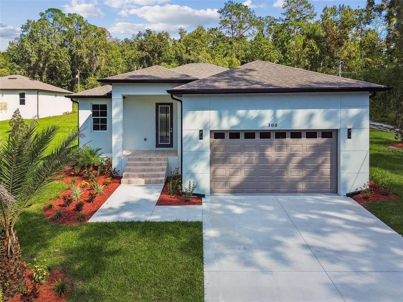 Front exterior of a new home in , Brooksville, FL, highlighting curb appeal (Image 24).