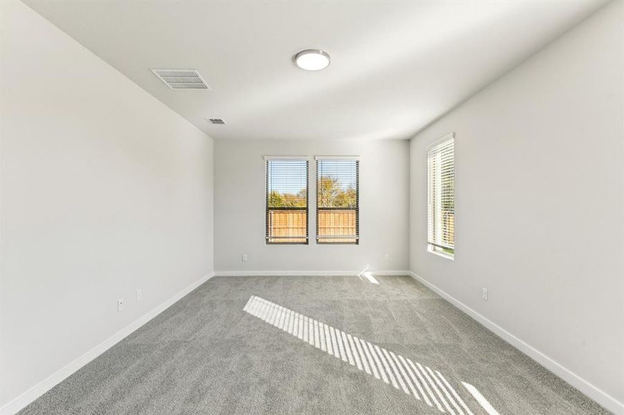 Primary Suite in the Wimbledon home plan by Trophy Signature Homes – REPRESENTATIVE PHOTO