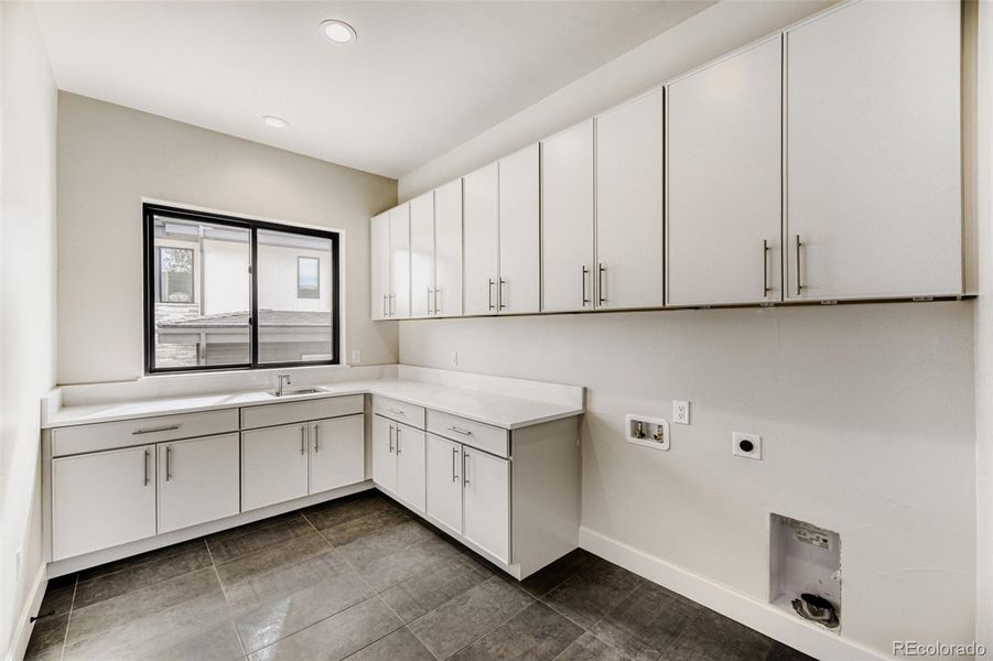 Laundry area, adjacent primary closet