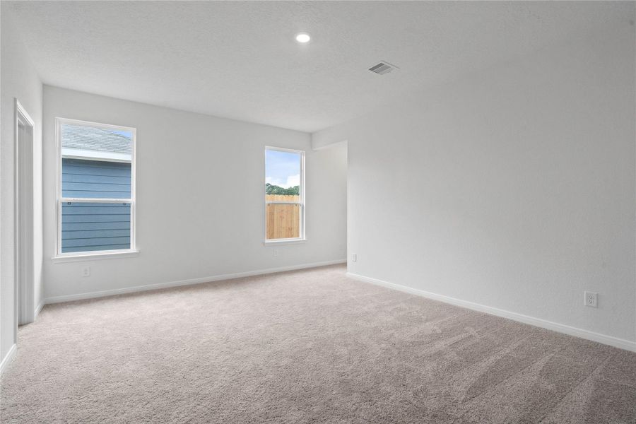 Natural light fills this elegant primary bedroom, creating a bright and inviting space to start and end your day. It features plush carpeting, high ceilings, recessed lighting, neutral tone paint, ensuite bathroom, and two walk-in closets! Natural light fills this elegant primary bedroom, creating a bright and inviting space to start and end your day. It features plush carpeting, high ceilings, recessed lighting, neutral tone paint, ensuite bathroom, and two walk-in closets!