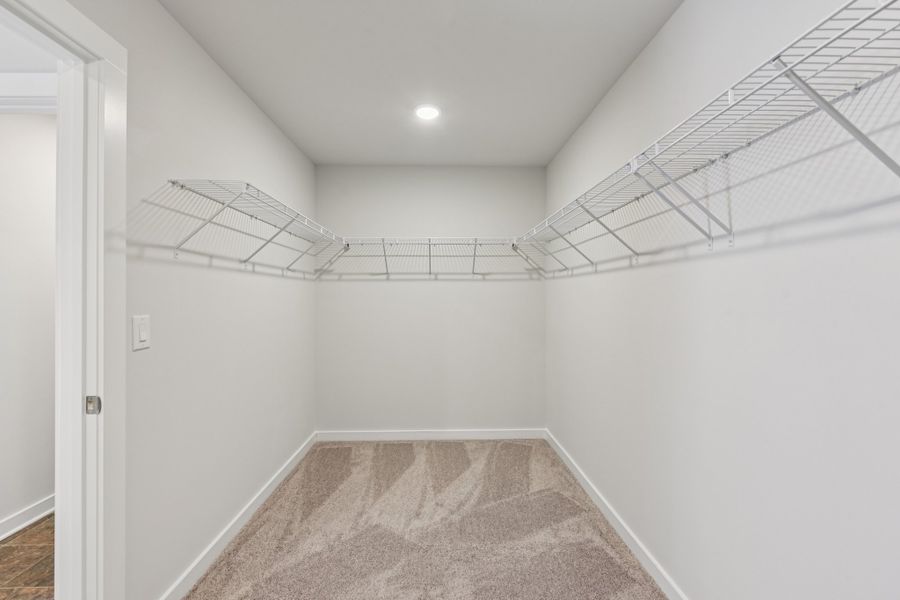 A hallway with white walls.