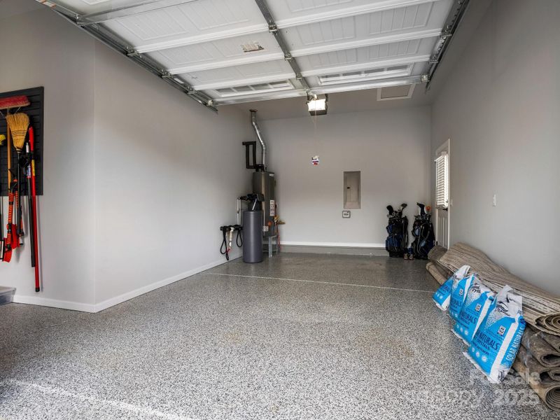 1-car, w/pass through to 2-car, epoxy floor, water softener system, side door leads to driveway