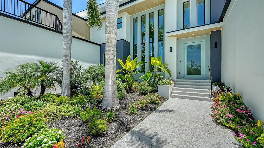 Front exterior of a new home in , Sarasota, FL, highlighting curb appeal (Image 24).