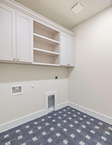 Laundry room with baseboards, hookup for a gas dryer, cabinet space, and electric dryer hookup