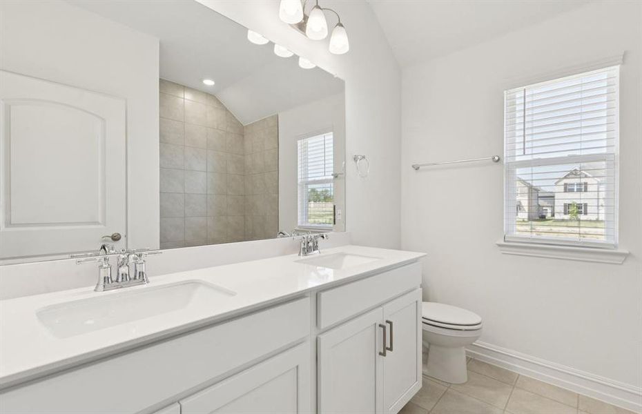 Secondary bathroom with double vanity and premium finishes Secondary bathroom with double vanity and premium finishes