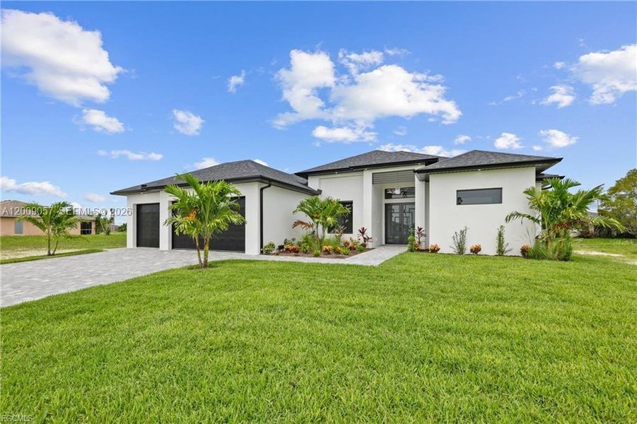 Front exterior of a new home in , Cape Coral, FL, highlighting curb appeal (Image 29).